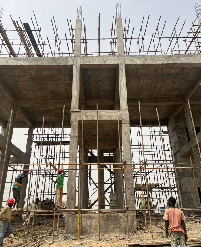 BSK City Office Sector — active construction on site with crew and reinforced concrete frame